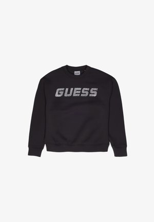 Schwarzes Sweatshirt mit gerippten Bündchen und Saum, das ein großes silbernes Glitzer-„GUESS“-Logo über der Brust trägt. Material aus Baumwollmischung.