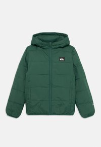Green puffer jacket with a hood, quilted design, full zipper, and side pockets. Features a black logo patch on the chest. Soft texture.