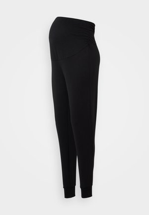 Sorte gravide leggings med en elastisk midje, tapered ben-design og tettsittende mansjetter ved anklene, laget av myk, fleksibel tekstil.