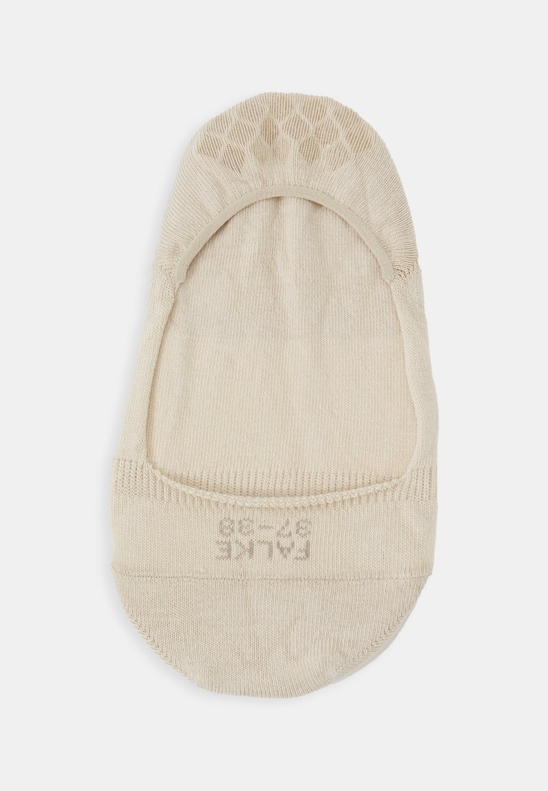 Beige Sock mit kurzem Schnitt, nahtlosem Rand und strukturiertem Obermaterial. Markierter Innenbereich zeigt ein Größenetikett für die Passform.