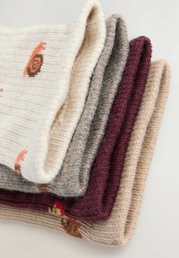 Four knit scarves in cream, grey, burgundy, and beige, with varying textures and patterns, including snails on the cream scarf.