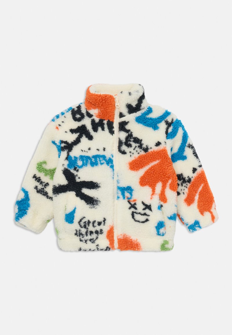 Fleecejakke med høy krage, med en kremfarget bakgrunn og flerfargede grafiske design i oransje, blått, grønt og svart. Glidelås-lukking.