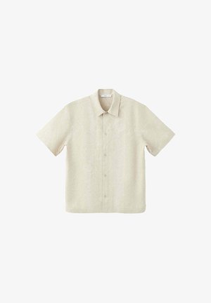 Chemise beige à manches courtes avec une broderie florale subtile, fermeture par boutons sur le devant et col classique, présentée sur fond blanc.