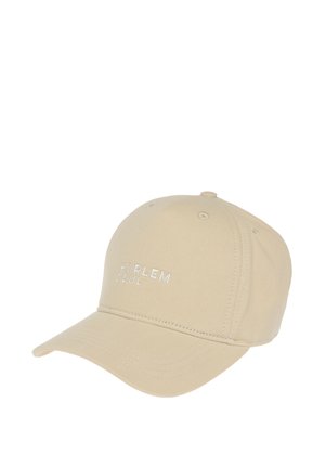 Beige baseball cap with curved brim and white embroidered text reading "HARLEM SOUL" on the front.
