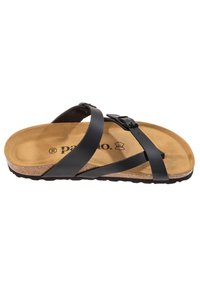 Sort sandal med stropper og en korksål, der har to justerbare stropper og en tekstureret brun indersål. Flad gummïsål med et bølgemønster.