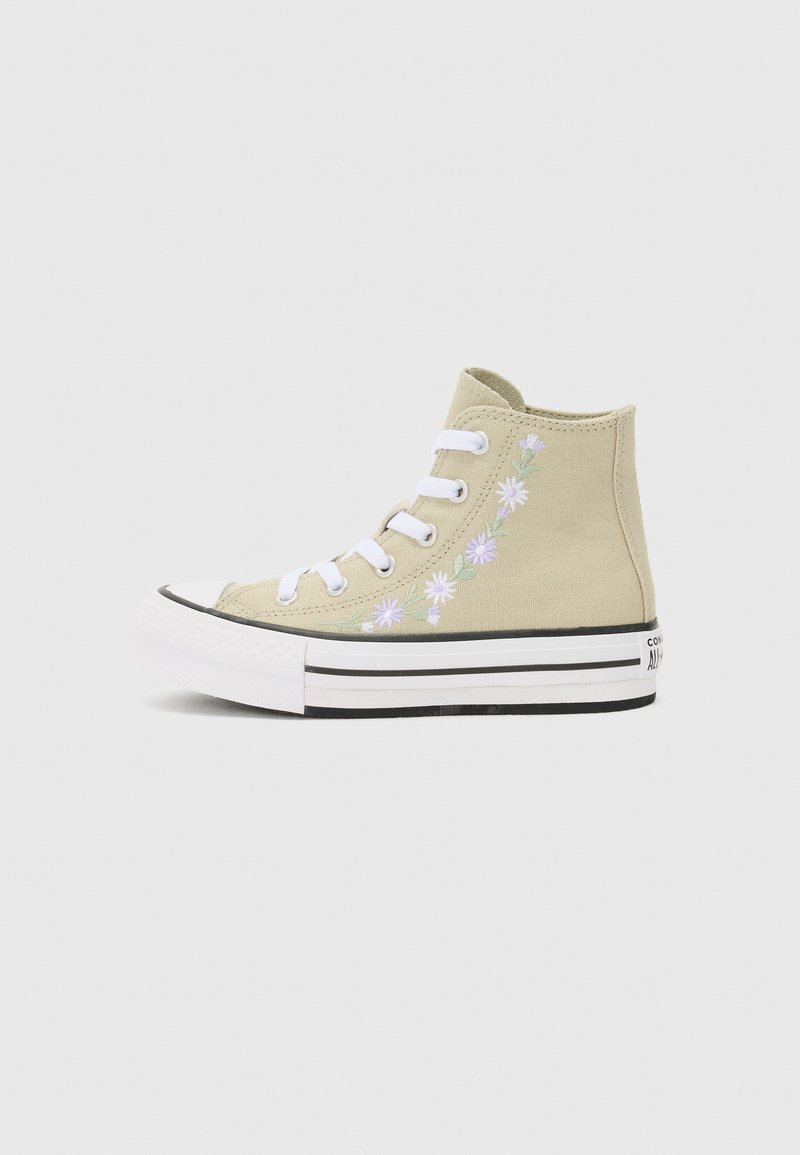 High-top canvas sneaker in light beige with floral embroidery, white laces, and a black and white striped rubber sole.