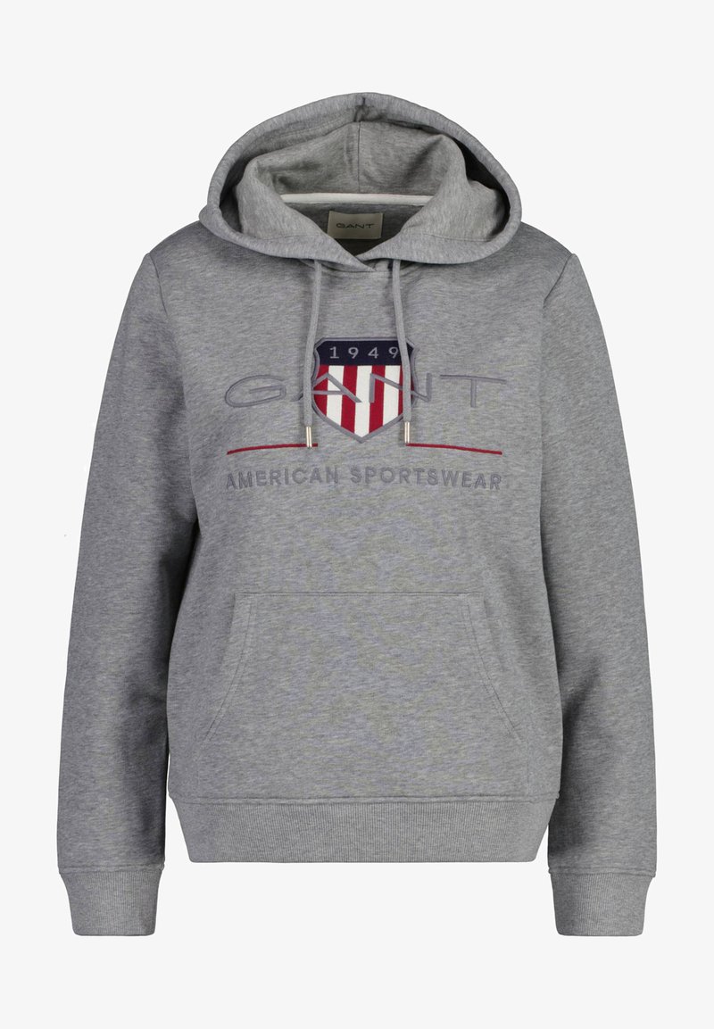 Grå hættetrøje med lomme foran, med et skjoldlogo i rød og blå. Ribbet manchetter og kant, lavet af blødt bomuldsblandingsstof.