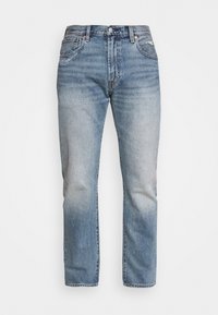 Světle modré džíny rovného střihu se slabým vyblednutím na stehnech a kolenou, měděné nýty a klasický design s pěti kapsami.