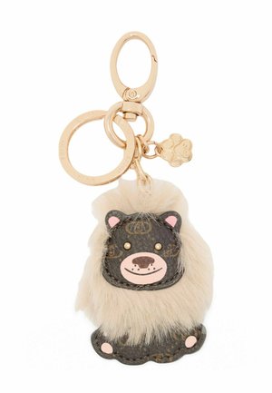 Il portachiavi a forma di leone presenta pelle marrone con una criniera cremosa, morbida e testurizzata, hardware dorato e accenti facciali rosa.