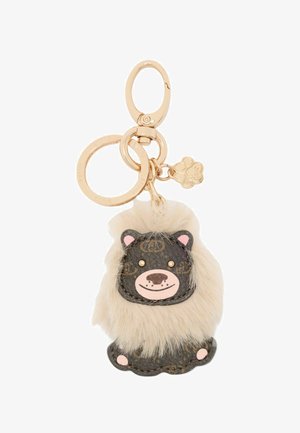 Porte-clés en forme de lion avec cuir marron, une crinière crémeuse texturée et duveteuse, quincaillerie dorée et accents faciaux roses.