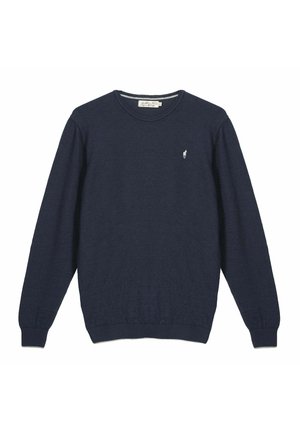 Pull à manches longues bleu marine avec col rond, poignets et ourlet côtelés, arborant un petit logo blanc brodé sur le côté gauche de la poitrine.