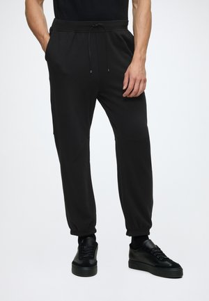 Calvin Klein ICON SPORT - Pantalon de survêtement - black