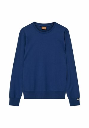 Sweat-shirt uni bleu marine à manches longues et col ras du cou, avec poignets et ourlet côtelés, affichant une petite étiquette noire et blanche sur le poignet de la manche gauche.