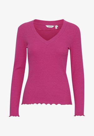Haut à manches longues en maille côtelée de couleur rose vif avec un col en V et un ourlet festonné. Fabriqué dans un matériau doux pour le confort et pour une silhouette ajustée.