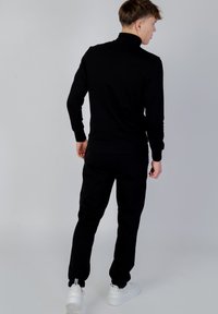 GAS LUSTIG POCKET - Sweater met rits - black