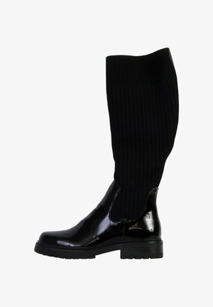 Bottes noires montantes en cuir verni avec un bout brillant et un tige en tissu côtelé texturé, dotées d'un talon épais et d'un design à enfiler.