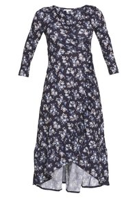 Robe portefeuille florale en bleu marine foncé avec des manches longues, ornée de fleurs bleu clair et crème, avec des détails volantés en bas et un ourlet asymétrique.