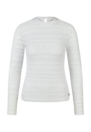 Witte lange mouw kanten top met geometrische en bloemmotieven, ronde halslijn en knoopsluiting aan de achterkant.