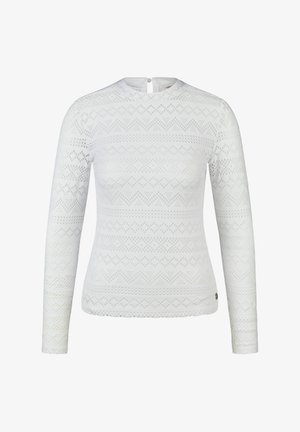 Weißes Spitzentop mit langen Ärmeln, geometrischen und floralen Mustern, rundem Ausschnitt und Knopfverschluss auf der Rückseite.