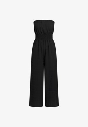 Combinaison noire sans bretelles avec un corsage smocké, une silhouette à jambes larges, un tissu texturé avec un motif subtil, et une taille élastique.
