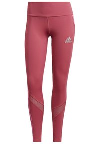 Figurbetonte, hochgeschnittene Leggings aus dunkelrosa Stoff mit glatter Textur, versehen mit Mesh-Elementen und einem Adidas-Logo am unteren Bein.