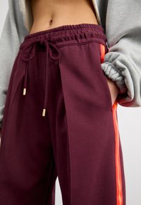 Nike Sportswear PANT - Treningo apatinė dalis - burgundy crush/bright crimson/dark pony