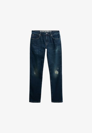 Jeans in denim blu scuro con lievi segni di usura su entrambe le ginocchia, modello a cinque tasche e chiusura con bottoni, mostrati aperti su sfondo bianco.