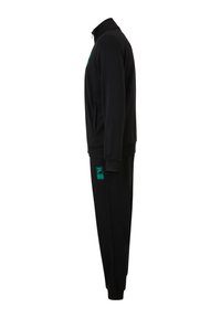 Ensemble de survêtement noir comprenant une veste à col zippé et un pantalon avec des poignets côtelés. Les accents notables incluent un détail de logo turquoise sur la poitrine et la cuisse.