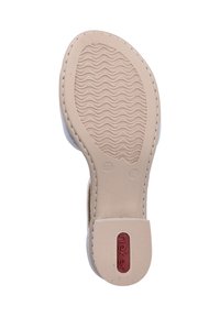 Sole of a shoe with a beige rubber base, textured grooves for grip, and a red logo. Size marked as 37. Stitched detailing along the edge.