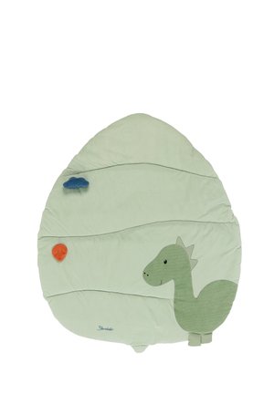 Green dinosaur-shaped mat made of soft fabric, featuring textured details, a smiling face, and decorative clouds and leaves in orange and blue.