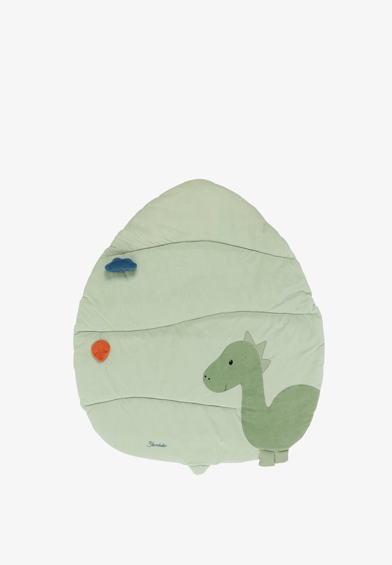 Green dinosaur-shaped mat made of soft fabric, featuring textured details, a smiling face, and decorative clouds and leaves in orange and blue.