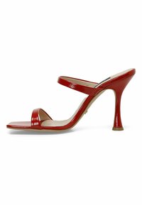 Red patent leather heeled sandal featuring two slim straps and a tapered stiletto heel, with a square toe and smooth, glossy texture.