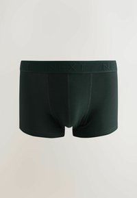 Tumši zaļi bokseršorti, kas izgatavoti no elastīga auduma, ar strukturētu elastīgu jostasvietu un "NEXT" logotipu, kā arī plakaniem šuvēm, nodrošinot komfortu.