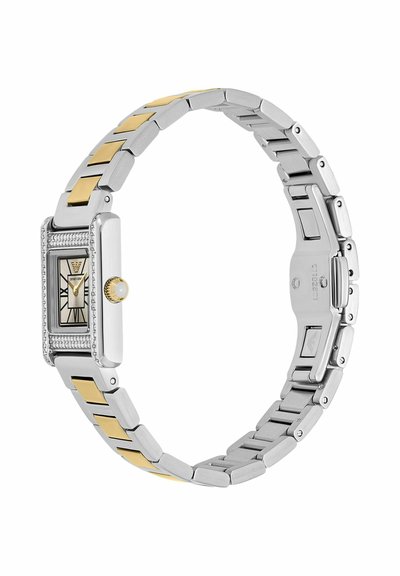 Rectangular silver watch with gold-tone links, diamond accents around face, Roman numerals, and a pearl-adorned crown on metal bracelet.