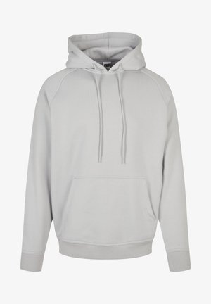 Világosszürke kapucnis pulóver, elülső zsebbel, bordázott mandzsettákkal és húzózsinórral. Puha anyagból készült, sima tapintással.