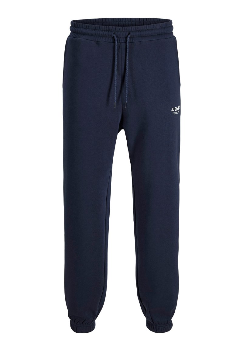 Navy blue joggers made of soft cotton blend. Elastic waistband with drawstring, cuffed ankles, and small logo detail on the side.