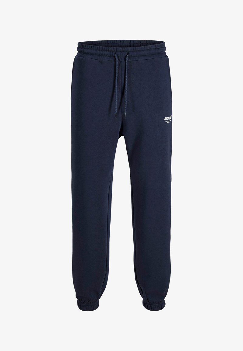 Marineblå joggere lavet af blødt bomuldsblandingsmateriale. Elastisk talje med snøre, ribbede ankler og lille logo detalje på siden.