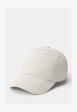 Off-white baseball cap with curved brim and subtle stitched logo on front panel, shown against a plain light background.
