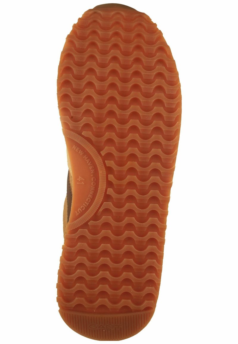 Rubberen schoenzool met een golvend loopvlakpatroon. Oranje kleur met een rond embleem met de tekst "NEW HAVEN-CONNECTICUT" en maat 41.