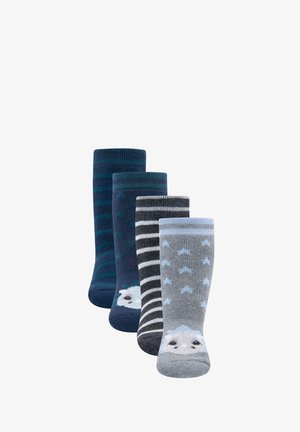 Four pairs of folded children's socks in blue and gray tones, featuring stripes, patterns, and animal faces near the toes.