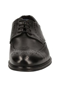 Schwarze Lederdressschuhe mit Brogue-Muster, schnürbare Vorderseite, glatte Oberfläche, runde Zehenpartie und eine niedrige, flache Sohle.