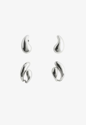 Four polished silver abstract-shaped earrings with smooth, curved, organic forms on a white background.