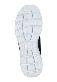 Semelle en caoutchouc blanche de sneaker présentant un motif de grip texturé, des rainures flexibles et un design durable, avec une section supérieure bleu marine visible.