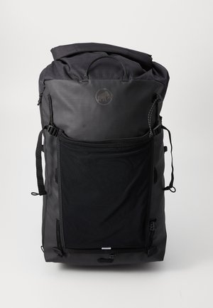 Black roll-top backpack made of durable fabric, featuring a large front pocket, adjustable straps, and a logo patch. Textured finish.