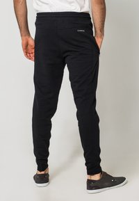 Jack & Jones JJCOPUSH - Jogginghose - black