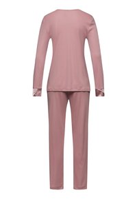 Långärmad rosa pyjamasset med rundad hals och avslutade ärmar, tillverkad av mjukt tyg, med matchande långa byxor.