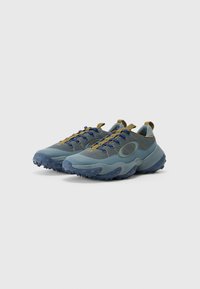 Blue and gray athletic shoes featuring a textured mesh upper, rubber outsole with treads, and yellow laces and accents.
