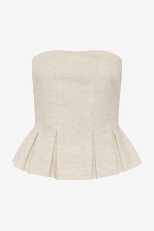 Top peplum bej din in fără bretele, cu cusături structurate și pliuri evazate la margine.