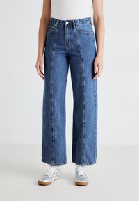 Blue high-waisted wide-leg jeans with a straight silhouette, featuring contrasting stitching and a classic five-pocket design.