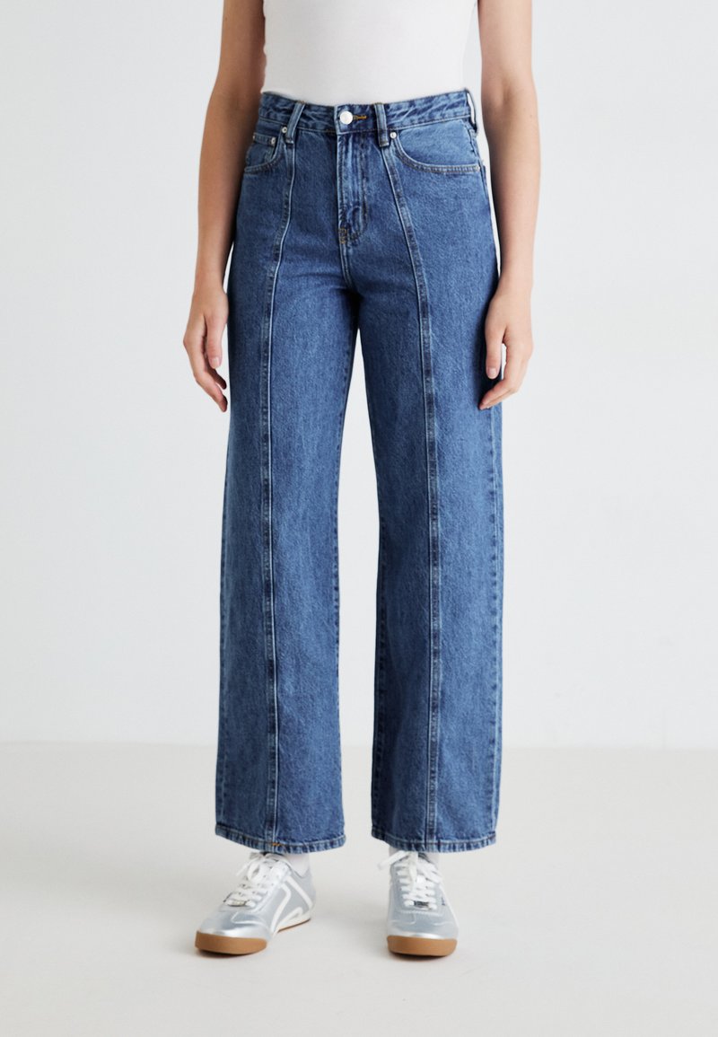 Blue high-waisted wide-leg jeans with a straight silhouette, featuring contrasting stitching and a classic five-pocket design.